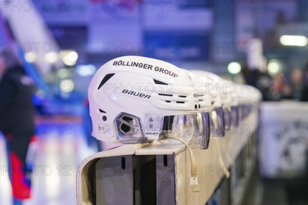 Row of white ice hockey helmets framed in a sports hall, Heilbronner Falken Vs Bietigheimer