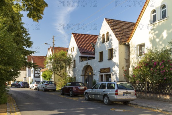 Village view of Naundorf, historic buildings with farmhouses, village green, Radebeul, Saxony,