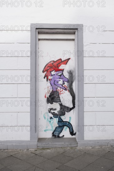 Graffiti on a disused entrance door, street photography, Linden-Limmer, Hanover, Lower Saxony,