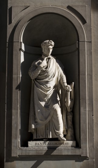 Sculpture by Dante Allighieri on the façade