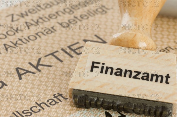 Stamp with tax office inscription on a share, capital gains tax