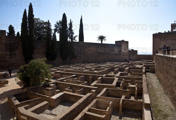 Alcazaba fortress, inner courtyard with Torre de la Vela, building floor plans exposed below