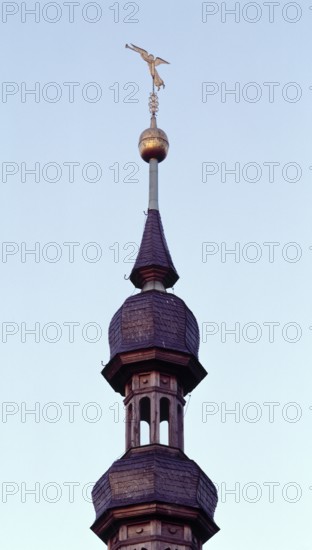 Schweinfurt, St Salvator. Trumpet blowing angel as weather vane on the baroque spire, St., Sankt,