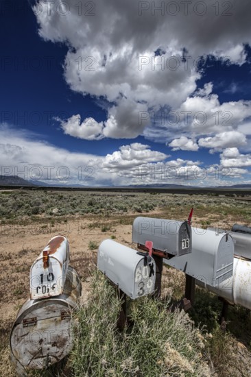 Letterboxes, mailboxes, cumulus clouds Highway 50, Loneliest Road in America, Ely, Nevada, USA,
