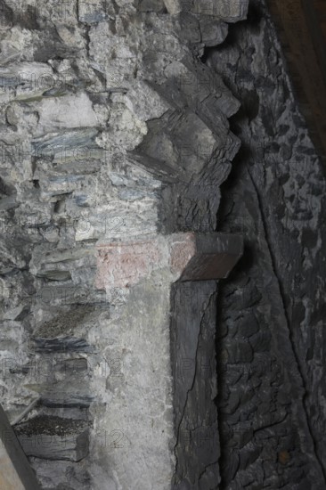 Above the choir vault, wall above the choir arch, remnant of a Romanesque window Church of St.,