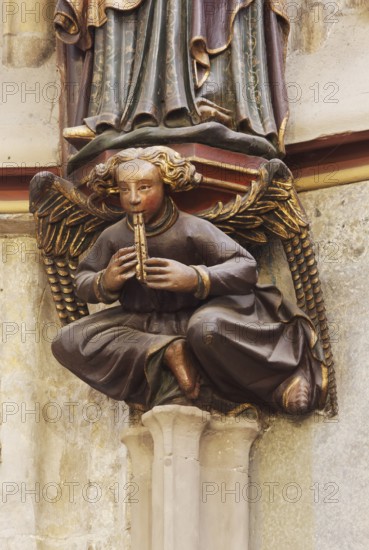 Choir hall, angel with flute as a console under the figure of Charlemagne on the eastern end wall