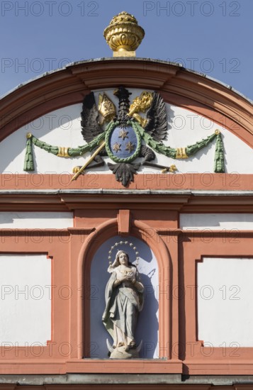 Prelature courtyard, crescent moon Madonna above the portal of the prelature