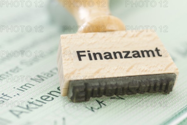 Stamp with tax office inscription on a share, capital gains tax