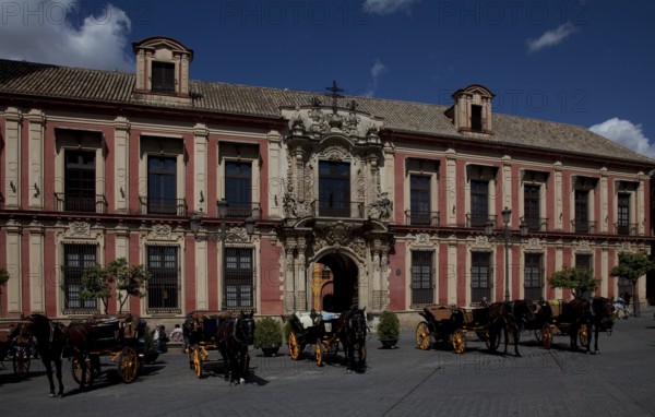Seville, Archbishop's Palace. South façade detail with portal in front Horse-drawn carriages, St,