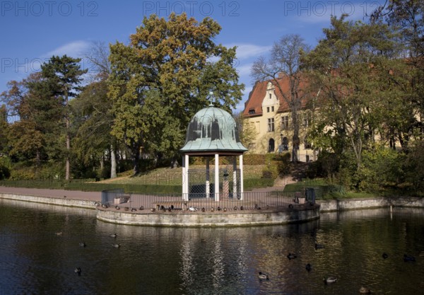 View across the pond to the pond arbour and castle
