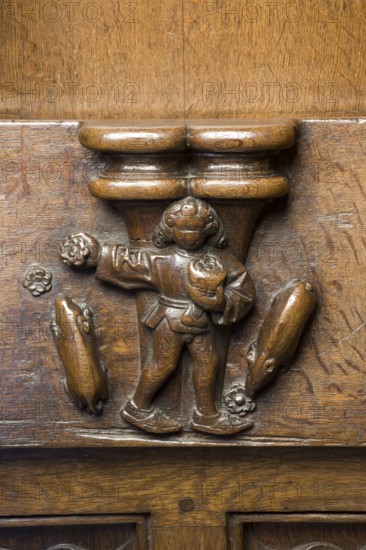 Choir stalls, drolleries on the stall sides with proverbial depictions, 1493 by Johannes Gruter