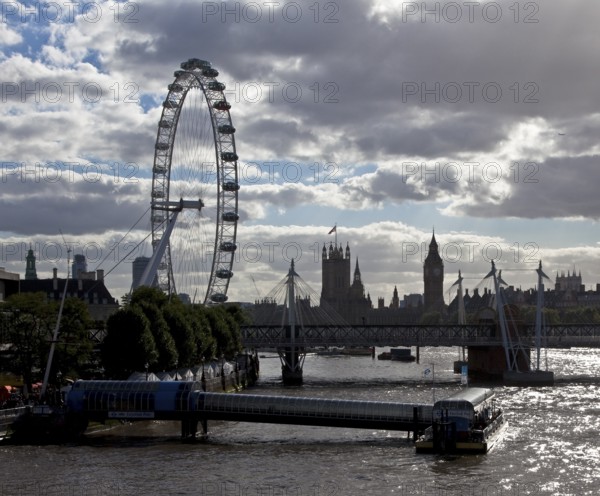 Left: LONDON EYE built 1999 height 135 m, centre: Houses of Parliament 1839-1888, front: Festival