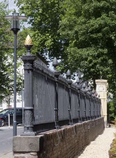 Restored wall and Tor tor to the park, golden pine cone