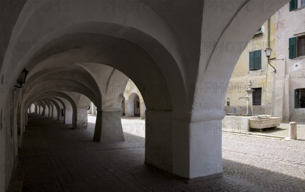Italy S-Tyrol Neumarkt. Laubengasse with a view of the alleyway fountain