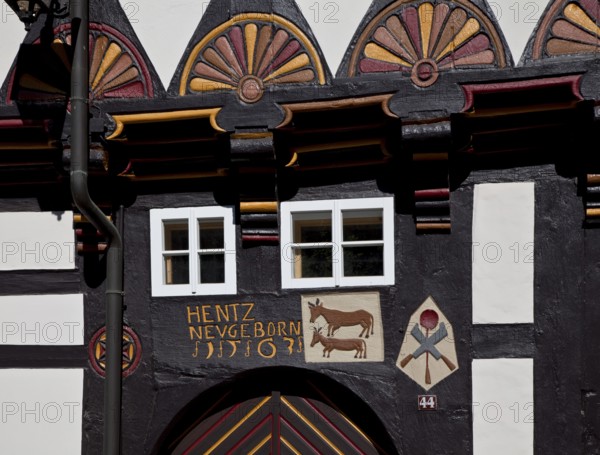Former cookshop 1563, portal detail with relief symbols of cattle, cooking spoon and knife