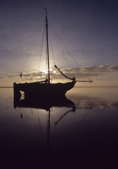 Wadden Sea, natural landscape. Sailing ship fell dry