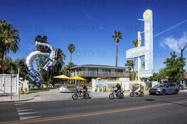 Cyclist in front of truck artwork, Fergusons Motel, Las Vegas, Nevada, USA, North America