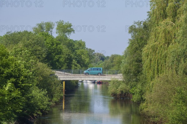 Road bridge with delivery van over the river Wümme in spring, Lower Saxony, Germany, Europe