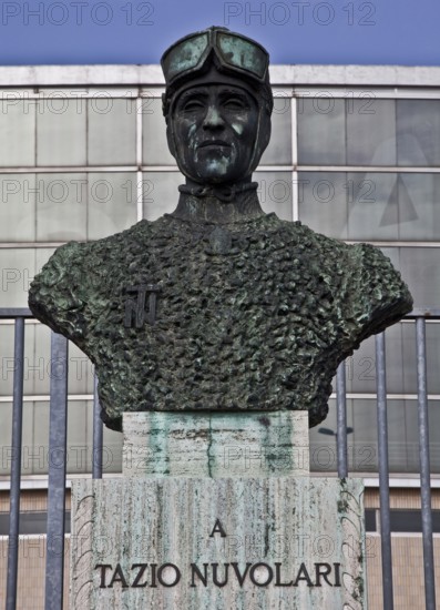 Motorbike and car racer, bust in front of the Palazzo dello Sport