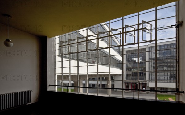 View through the stairwell window of the former vocational school between the ground floor and
