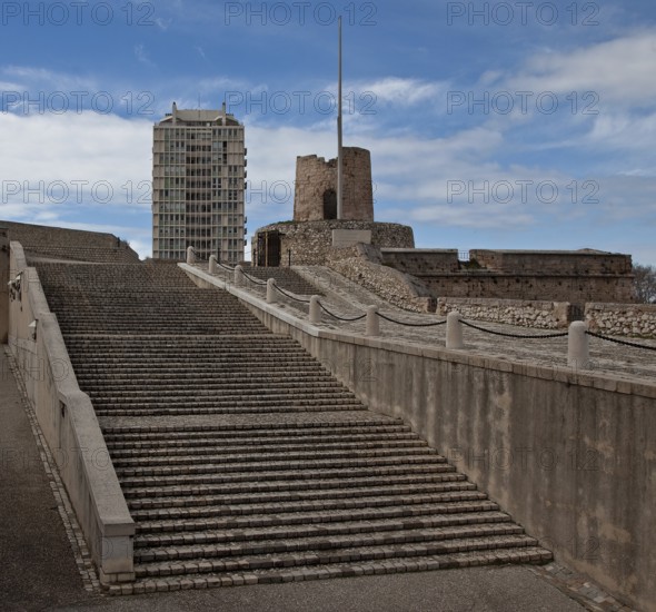 Staircase and ramp to the town, battery tower and modern tower block above