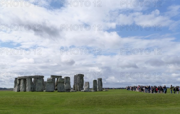 Stonehenge, prehistoric stone circle with tourists