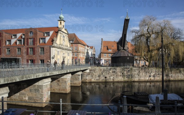 Lüneburg Old Crane 93433 built in 1797 with inner pedal wheel on the banks of the Ilmenau in