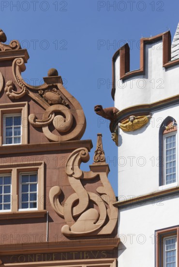 Left: so-called Red House, representative late Renaissance building, two-storey volute gable. The