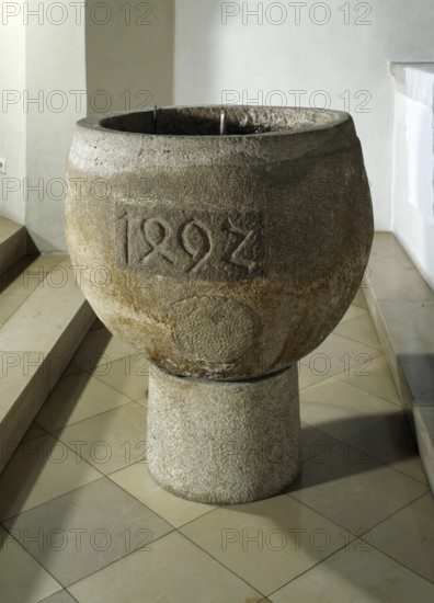 Baptismal font from 1492, heavily reworked