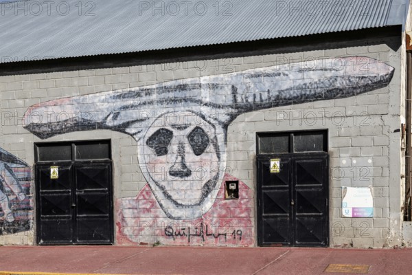Mural with aboriginal grove cult, harbour of Ushuaia, Argentina, South America