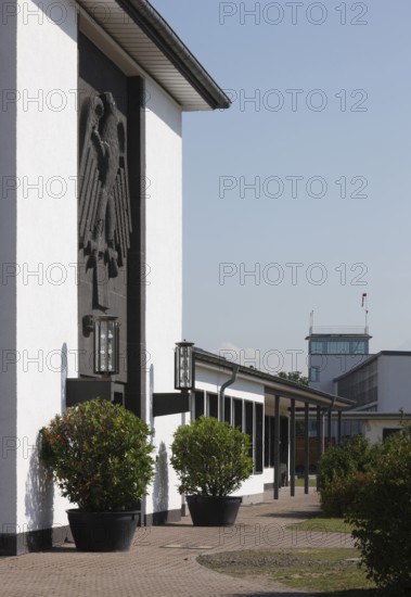 Butzweilerhof, reception building from 1936 with eagle, tower in the background