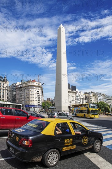 Obelisk and taxi at the Plaza de la Republica, Avenida 9 de Julio, Buenos Aires, Argentina, South