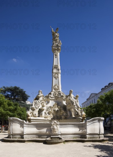 Rococo fountain with depictions of the four seasons and St George as dragon slayer on obelisk,