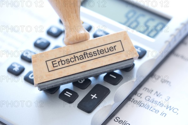 Stamp with the inscription inheritance tax, tax revenue, inheritance, will, assets, taxation