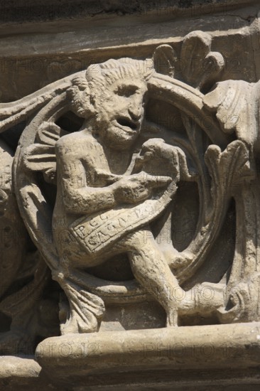 Romanesque capital on the west side of Paradise, Devil noting sins, St., Saint, Saint