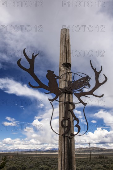 House number with fly fishing artwork, Highway 50, Loneliest Road in America, Ely, Nevada, USA,
