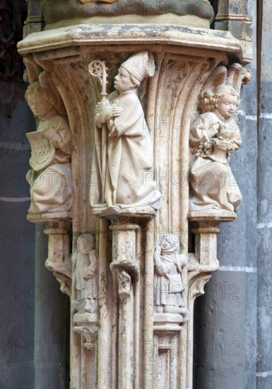 Stone figure of Cornelius in the choir, console with bishop and angels after the 2012 restoration,