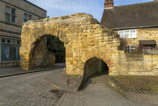 Newport Arch on Ermine Street, Roman entrance gateway to city of Lincoln, Lincolnshire, England, UK
