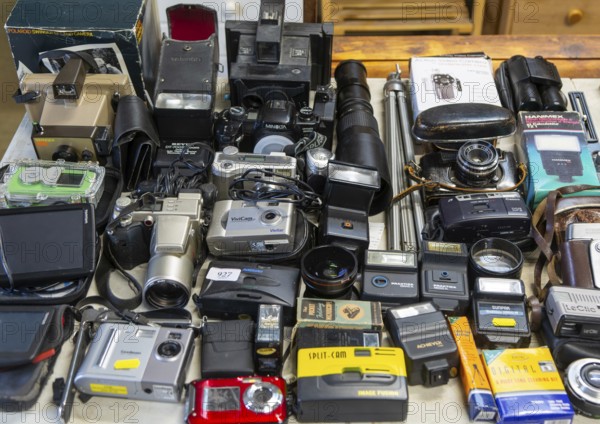 Display of old secondhand cameras and photographic equipment on display at auction, Campsea Ashe,