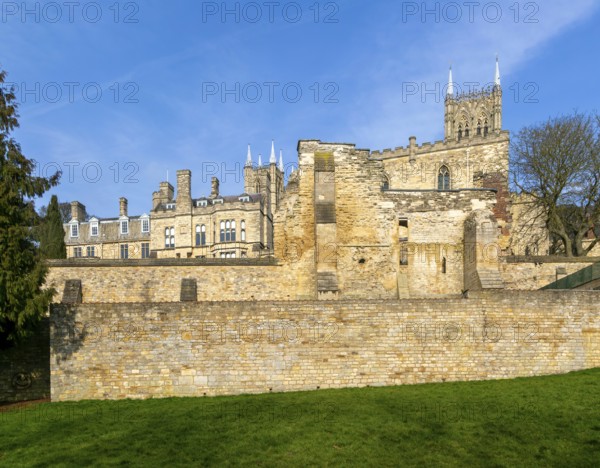 Walls of medieval Bishops' Palace from Temple Gardens park, city of Lincoln, Lincolnshire, England,