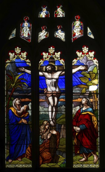 Stained glass window of Jesus Christ Crucifixion Cross, church of Saint John the Baptist, Devizes,