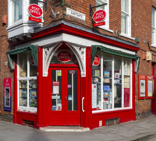 Post Office corner shop painted bright red, Eastgate, Bailgate, Uphill area of city of Lincoln,
