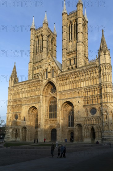 West frontage of cathedral church in evening light, Lincoln, Lincolnshire, England, UK