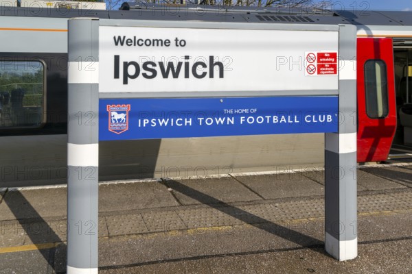 Welcome to Ipswich sign, home of Ipswich Town Football Club, platform of railway station, Ipswich,