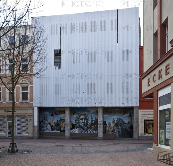 Köthen Anhalt Schalaunische Straße vacant commercial building with damaged façade cladding 74581