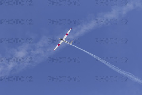 Airshow, glider with contrails against blue sky, Montreal, Province of Quebec, Canada, North