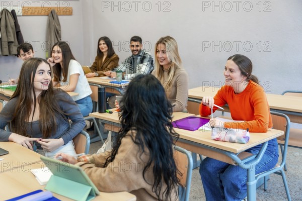 Cheerful university students are actively participating in a class, engaging in discussions and