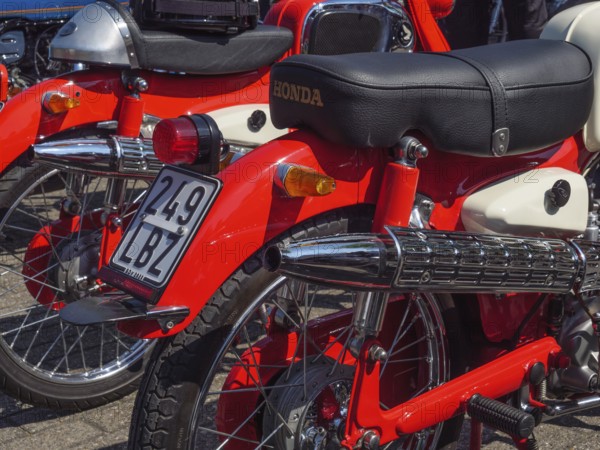 Two red Honda motorbikes with dual exhaust and a classic style, Appelhülsen, münsterland, germany