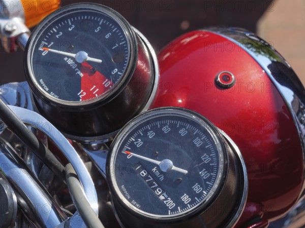 Motorbike displays with speedometer and rev counter, red tank in the background, Appelhülsen,