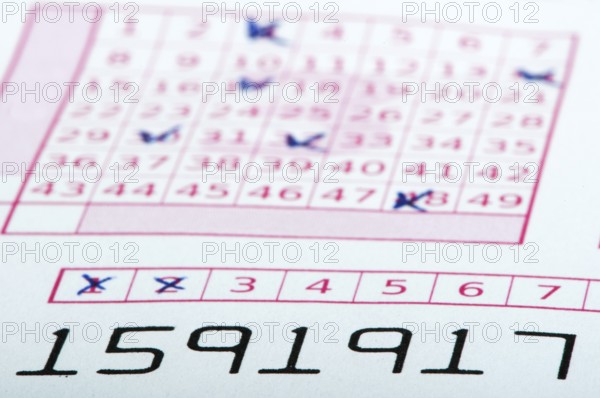 Marked lottery ticket close up. Studio shot